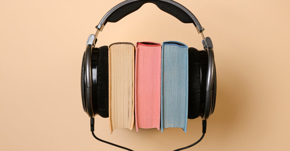 Black Corded Headphones with Colorful Books in Between